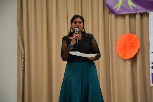 Vanitha Daniel speaking on stage